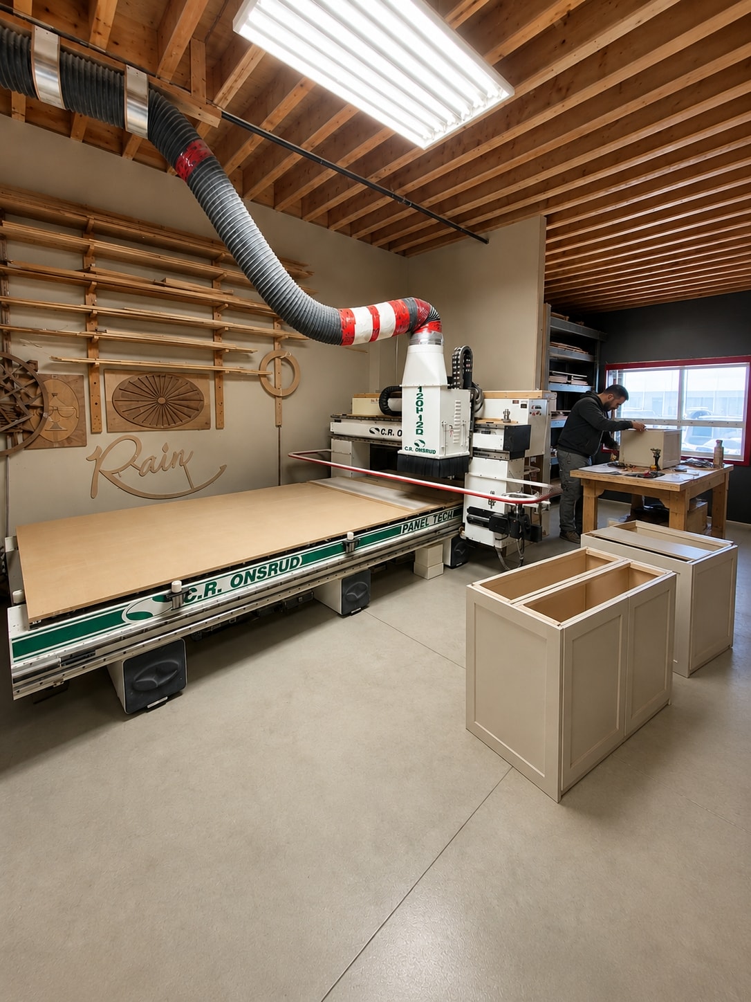 Two cabinetmakers assembling a custom cabinet carcass in a workshop